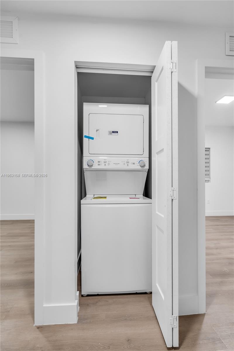 3728 Northwest 19th Avenue, Unit 304 Miami, FL 33142 - Photo 21 of 26 a utility room with washer and dryer