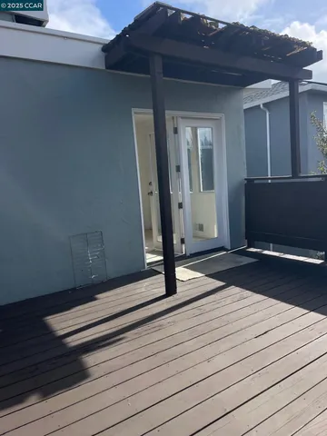 a kitchen with stainless steel appliances granite countertop white cabinets and a stove top oven