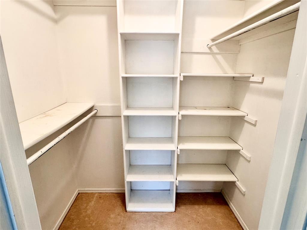 4014 Ridglea Country Club Drive, Unit 407 Fort Worth, TX 76126 - Photo 14 of 26 a view of walk in closet with empty racks
