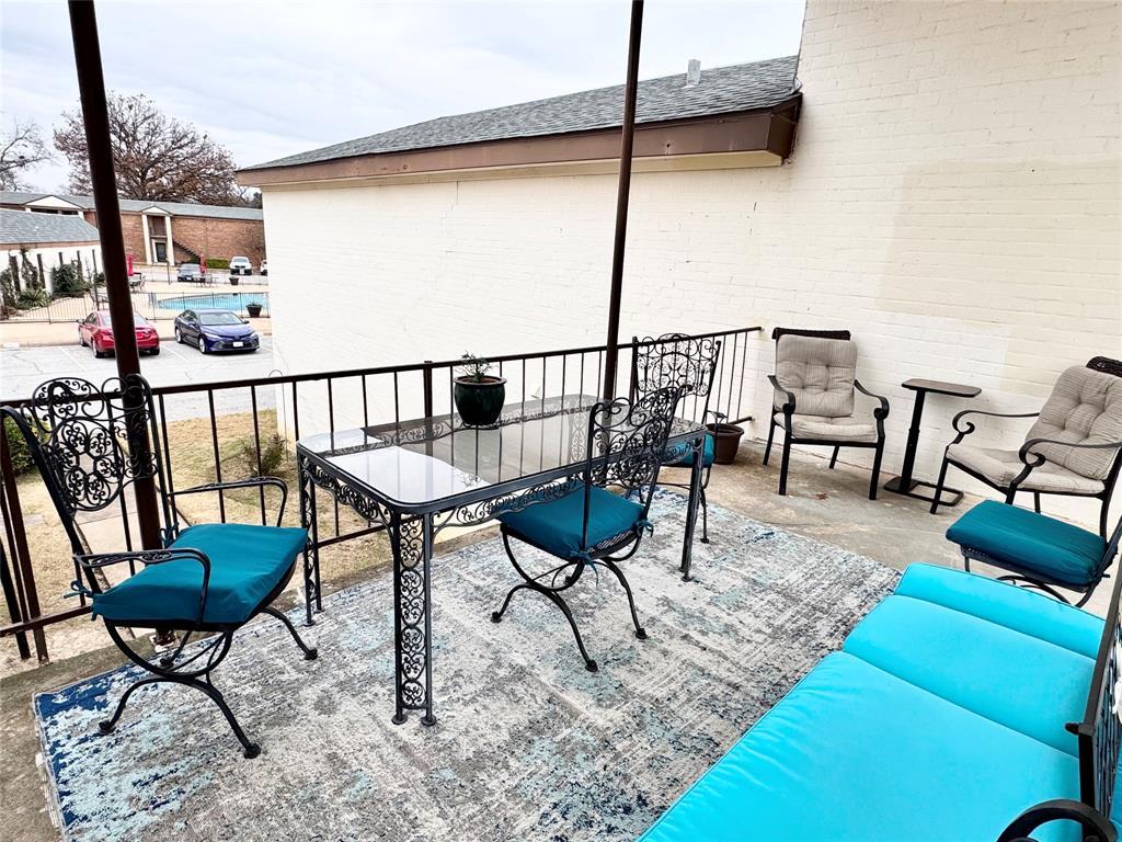 4014 Ridglea Country Club Drive, Unit 407 Fort Worth, TX 76126 - Photo 22 of 26 a view of a chairs and table in the patio