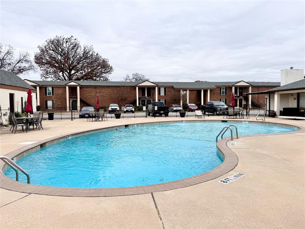 4014 Ridglea Country Club Drive, Unit 407 Fort Worth, TX 76126 - Photo 26 of 26 a swimming pool view with a outdoor seating