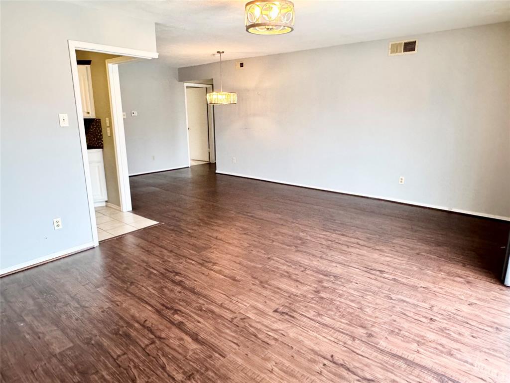 4014 Ridglea Country Club Drive, Unit 407 Fort Worth, TX 76126 - Photo 4 of 26 a view of a hallway with wooden floor