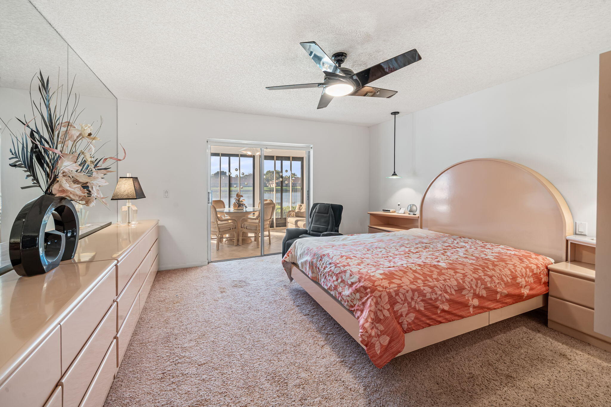 8030 Springside Court, Unit D Boca Raton, FL 33496 - Photo 14 of 39 Primary bedroom with slider to patio