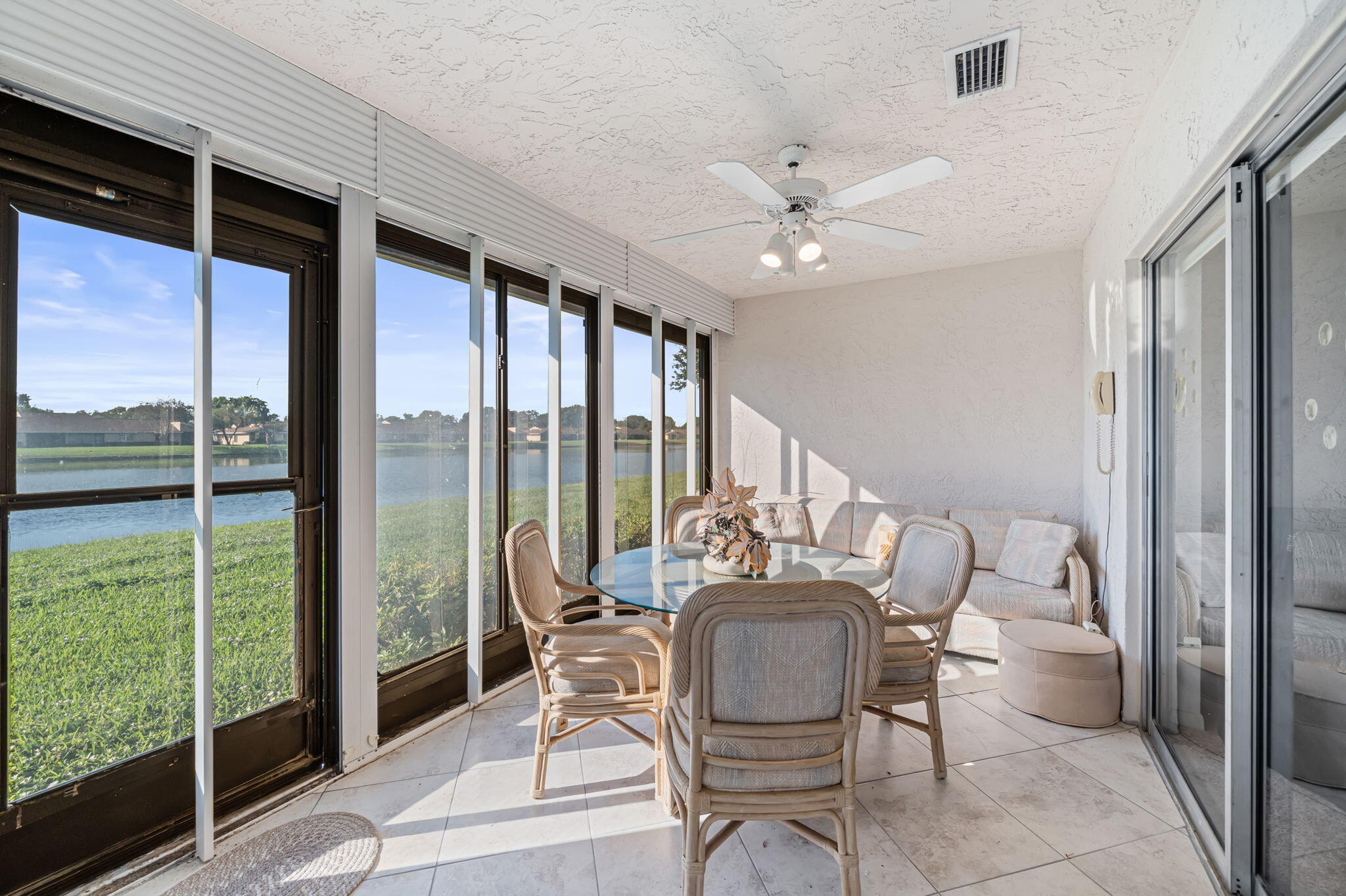 8030 Springside Court, Unit D Boca Raton, FL 33496 - Photo 19 of 39 Enclosed Patio with lake view