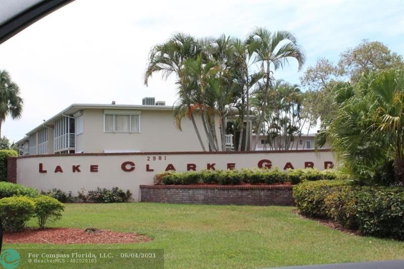 Lake Clarke Gardens Condominiums Lake Worth Beach, FL 33461 - Photo 1 of 34 a view of a house with a yard