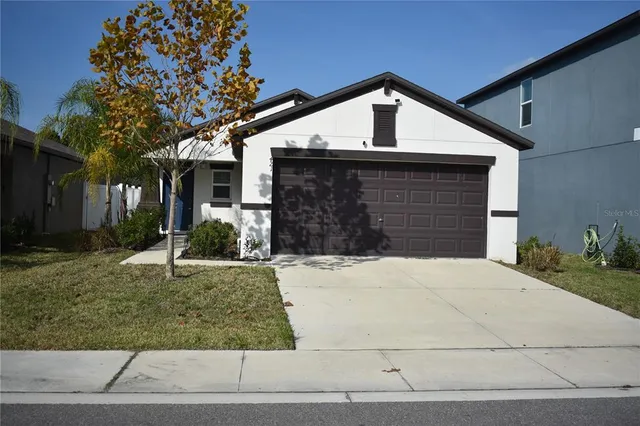 a front view of a house with garage