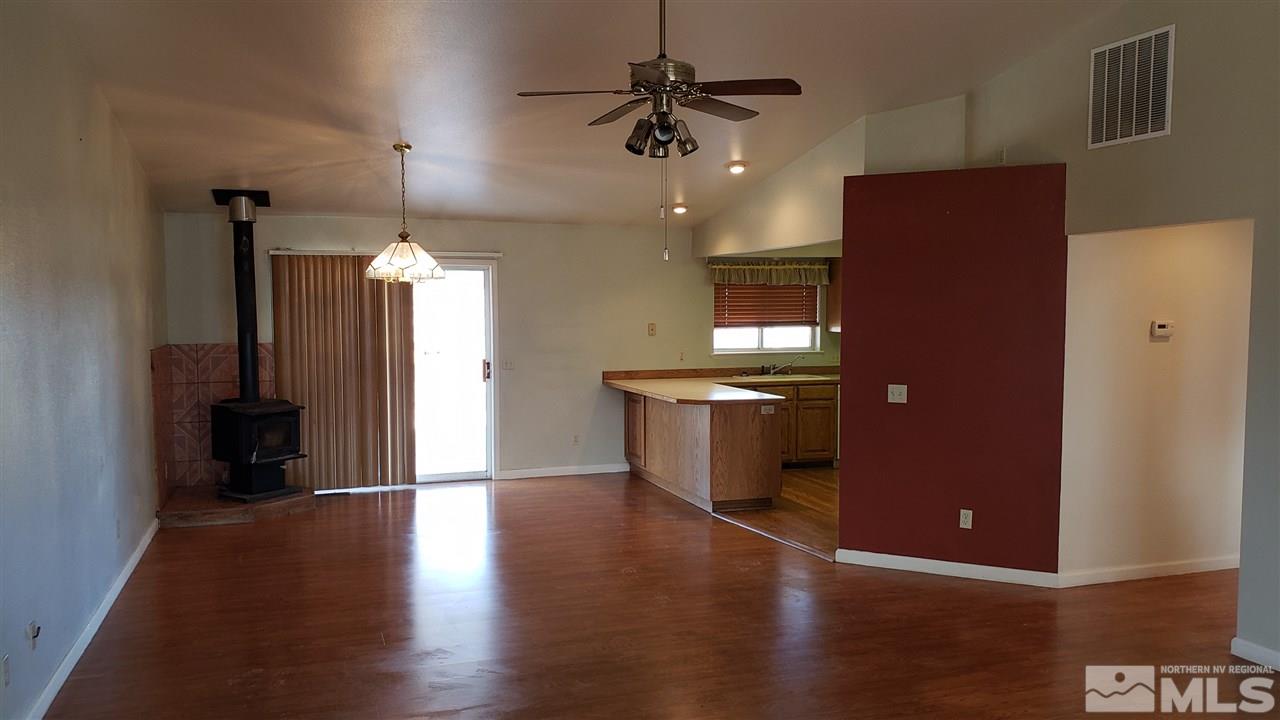 1840 Rice Road Fallon, NV 89406 - Photo 9 of 30 a view of a kitchen with a sink and a refrigerator