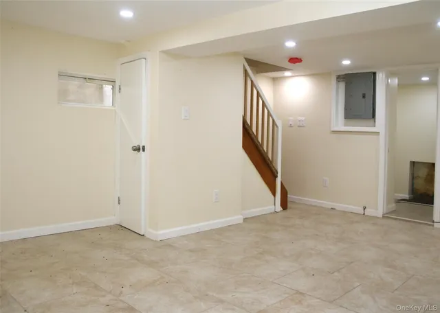 an empty room with stairs and ventilation