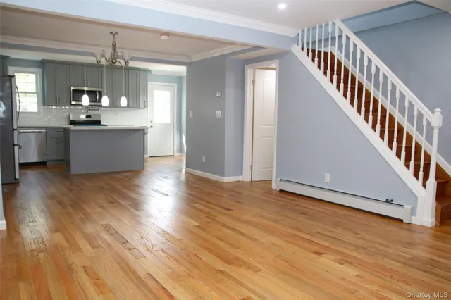a view of kitchen and kitchen with wooden floor