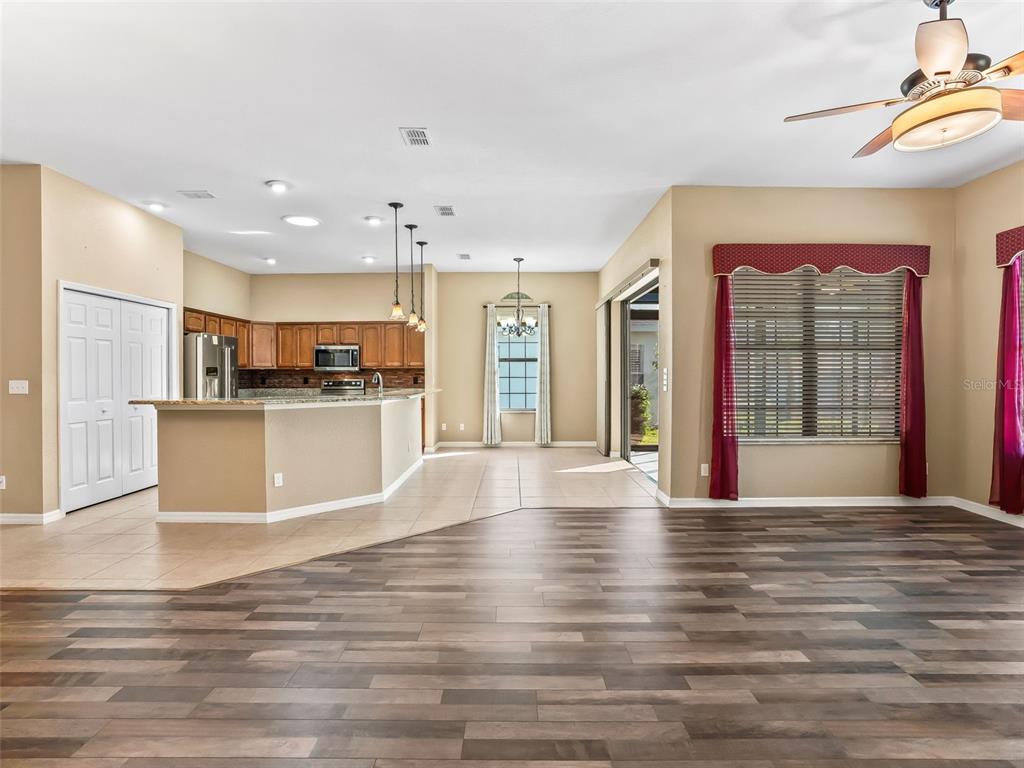 16896 South East 110th Court Road Summerfield, FL 34491 - Photo 18 of 61 a view of a kitchen with kitchen island a sink stainless steel appliances and cabinets