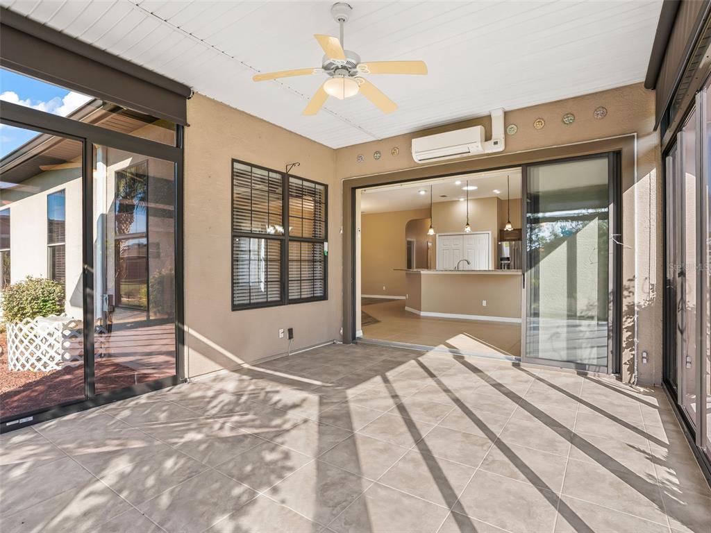 16896 South East 110th Court Road Summerfield, FL 34491 - Photo 27 of 61 a bedroom with a bed and a large window with outer view