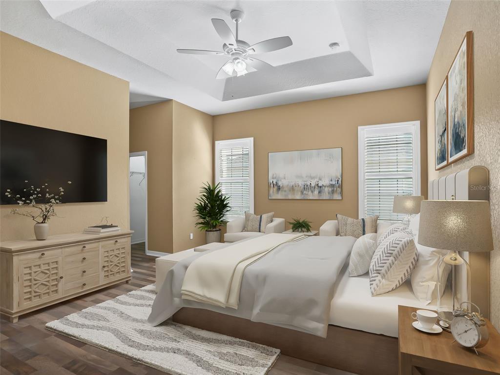 16896 South East 110th Court Road Summerfield, FL 34491 - Photo 31 of 61 a bedroom with a large bed and a flat screen tv