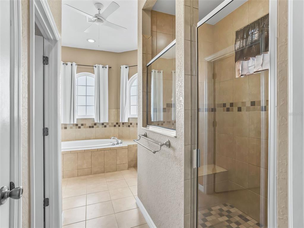 16896 South East 110th Court Road Summerfield, FL 34491 - Photo 34 of 61 a spacious bathroom with a tub shower and sink