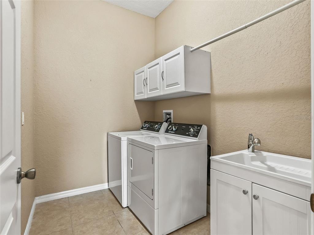 16896 South East 110th Court Road Summerfield, FL 34491 - Photo 43 of 61 a utility room with dryer and washer