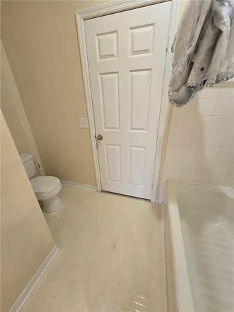 a bathroom with a granite countertop shower and a sink