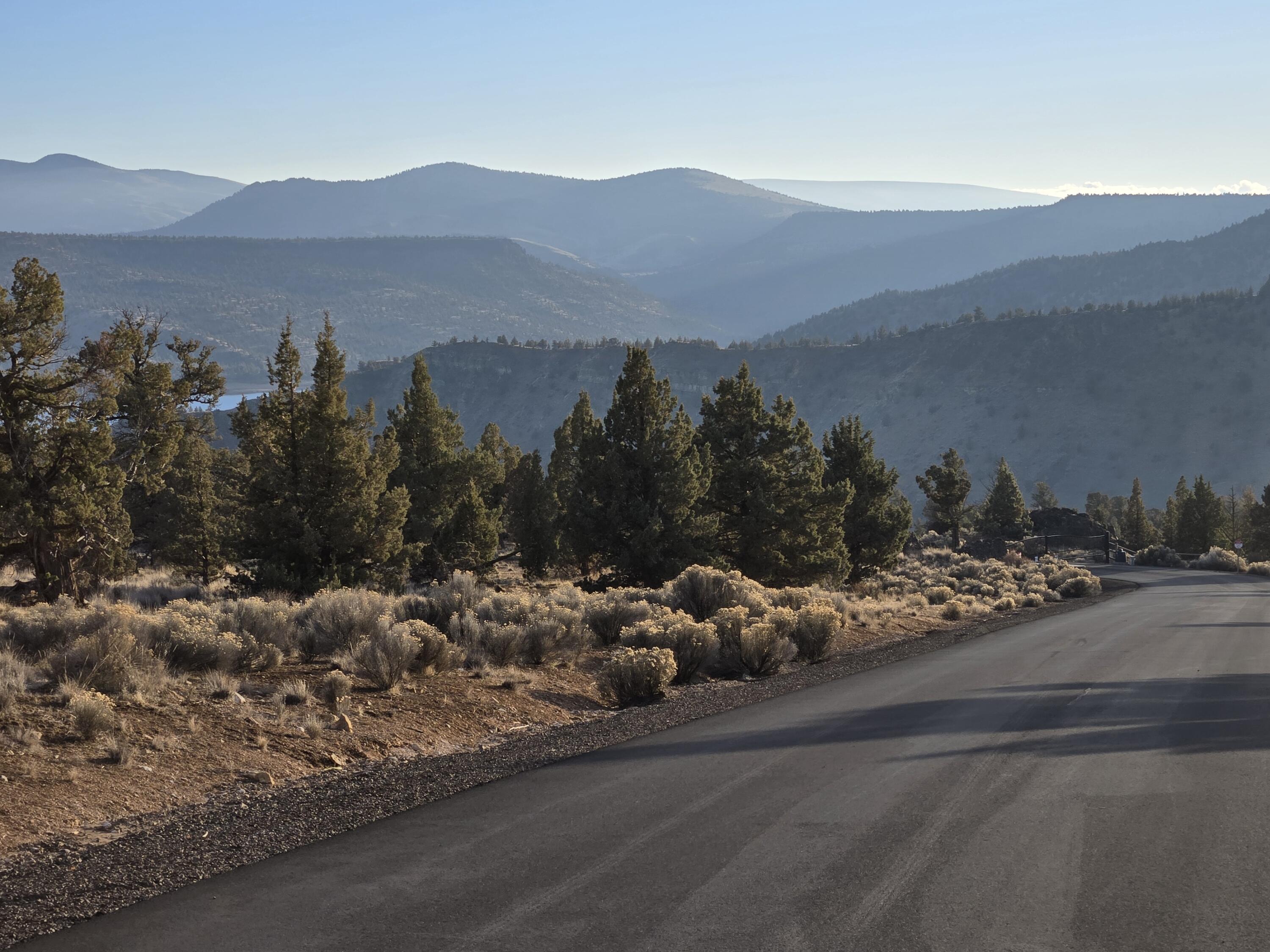 10033 Pavati Road, Unit LOT 34 Prineville, OR 97754 - Photo 4 of 10 a view of a town with mountains in the background