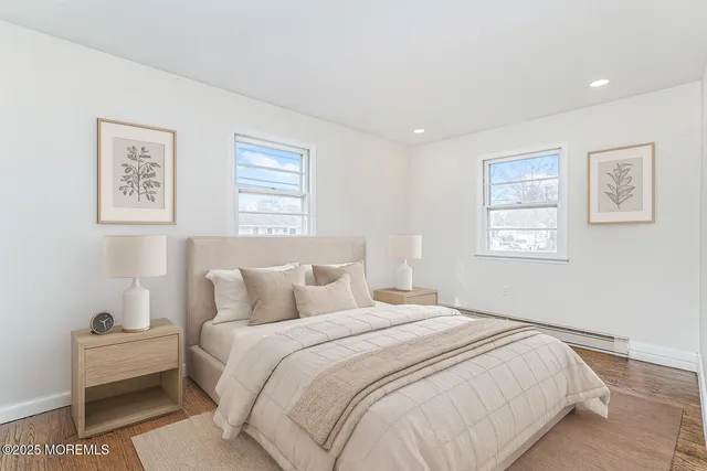 a bedroom with bed and a window