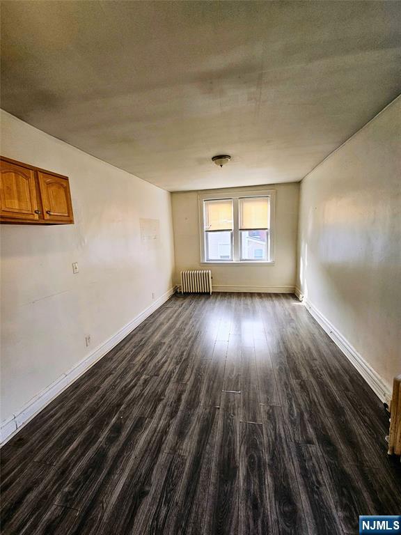 32-34 Halstead Street Kearny, NJ 07032 - Photo 7 of 12 wooden floor in an empty room with a window