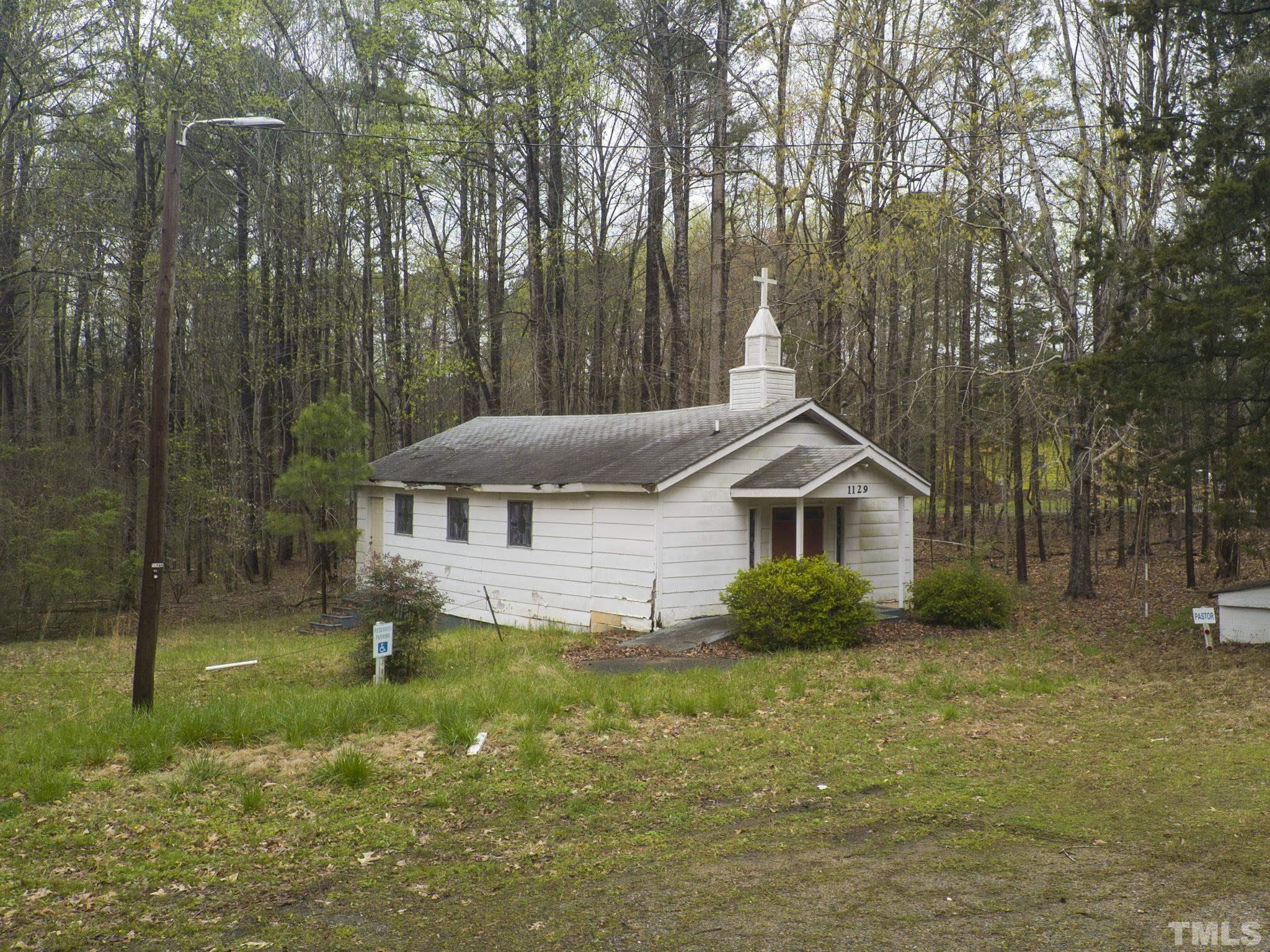1129 Mt Vernon Church Road Raleigh, NC 27615 - Photo 8 of 11 a front view of a house with a yard