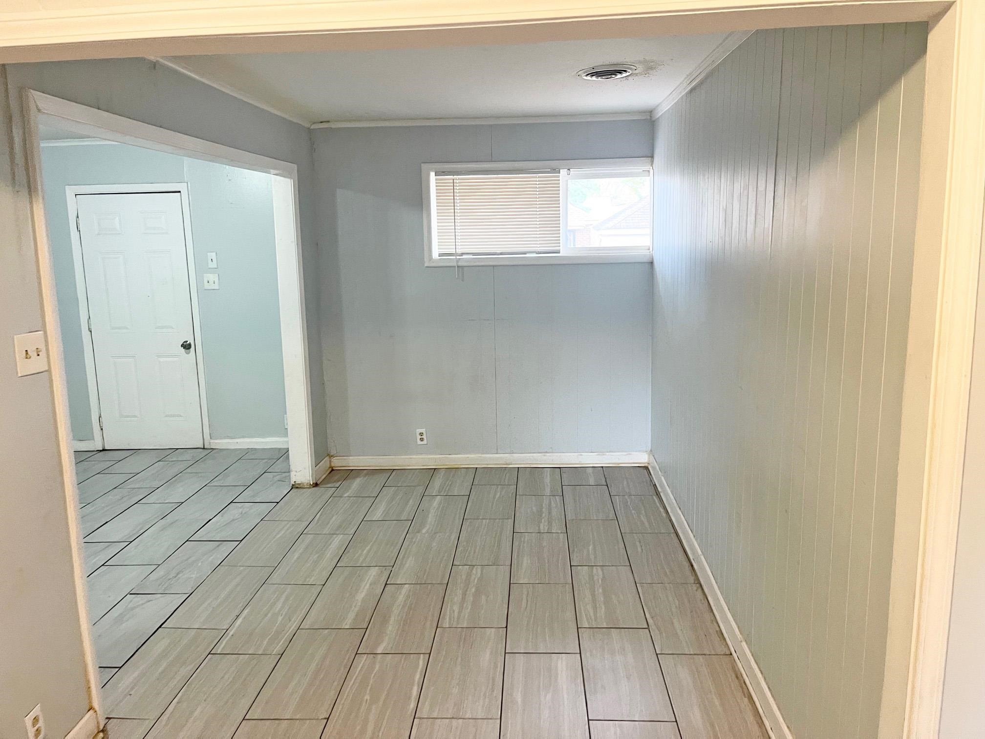 1783 Danville Road Memphis, TN 38117 - Photo 3 of 12 a view of an empty room and wooden floor