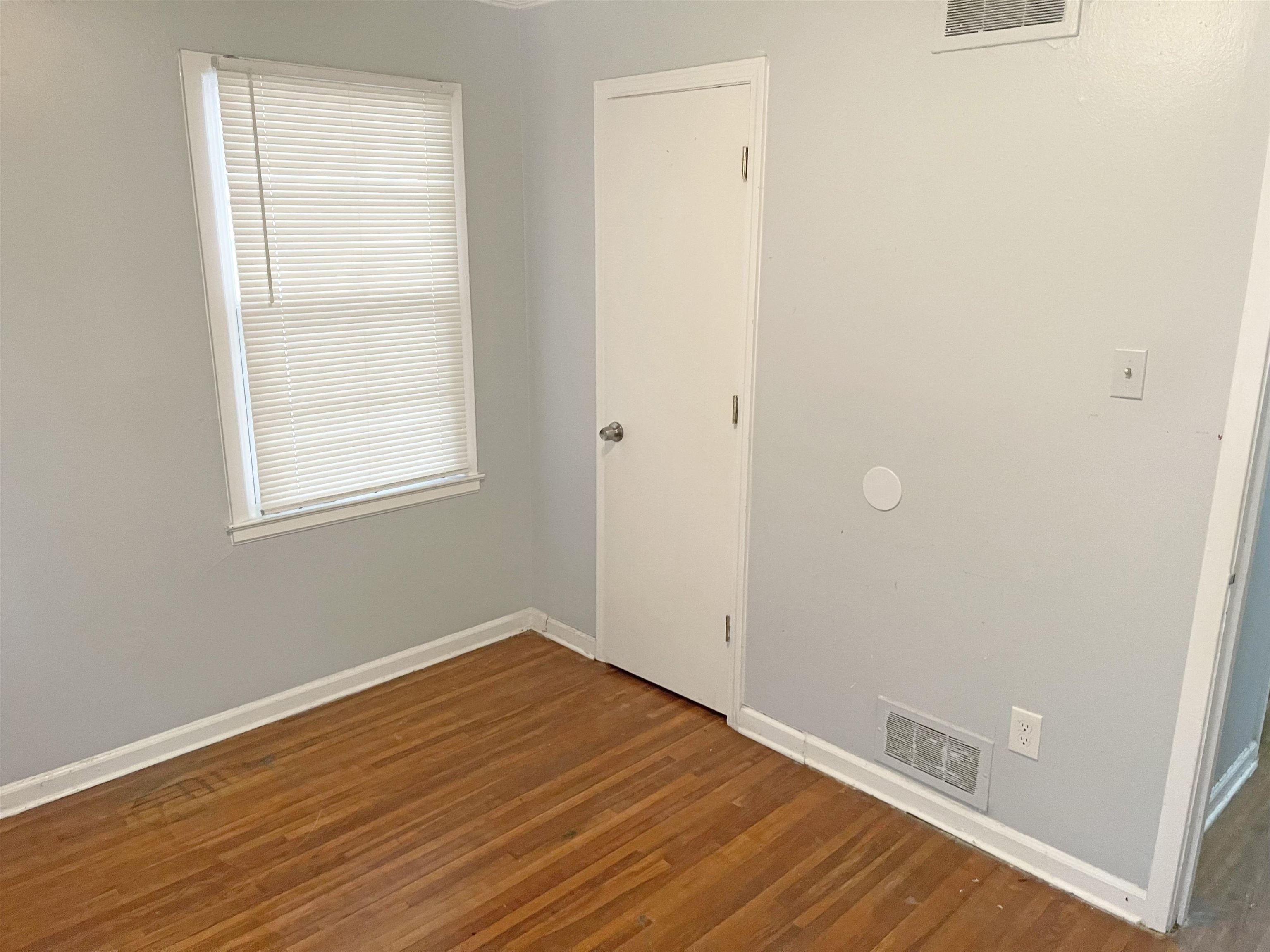 1783 Danville Road Memphis, TN 38117 - Photo 8 of 12 a view of a room with wooden floor and a window