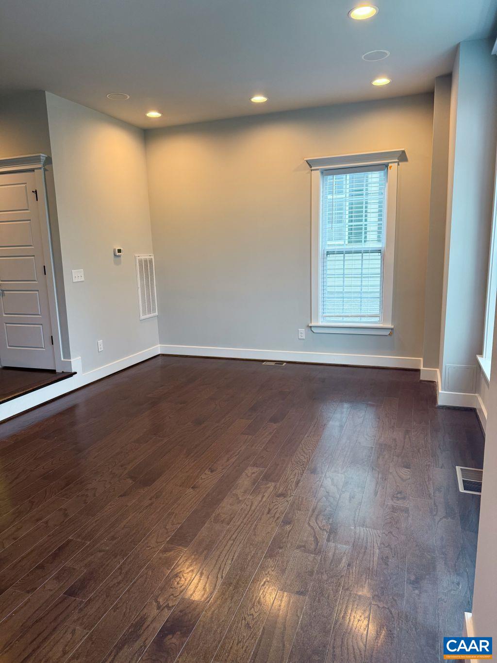 2038 Avinity Loop Charlottesville, VA 22902 - Photo 12 of 36 an empty room with wooden floor and windows