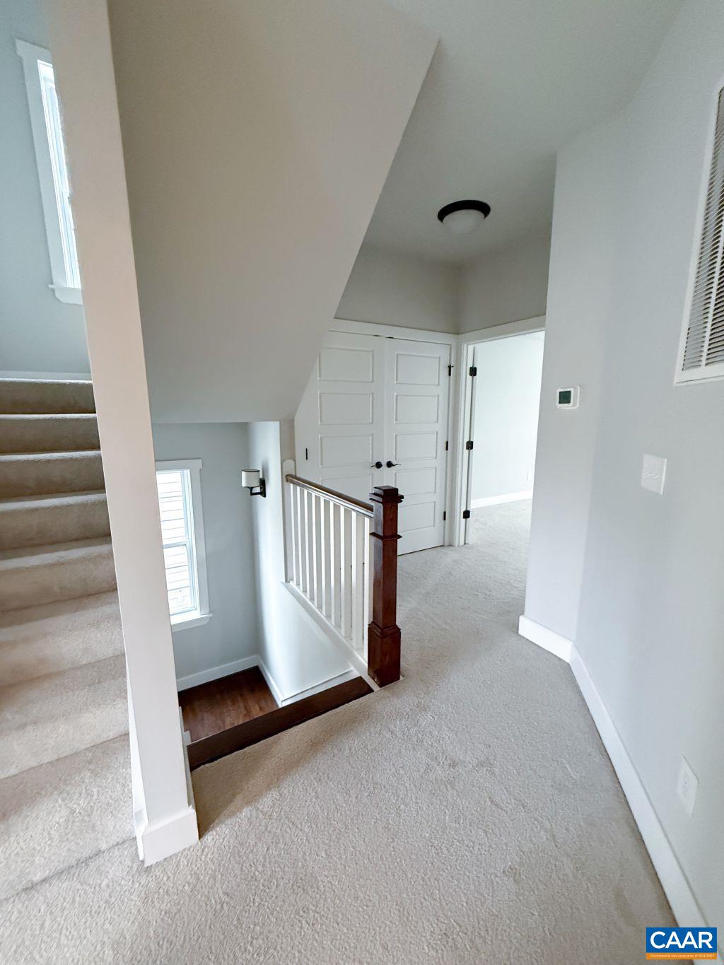 2038 Avinity Loop Charlottesville, VA 22902 - Photo 14 of 36 a view of empty room with stairs and a window