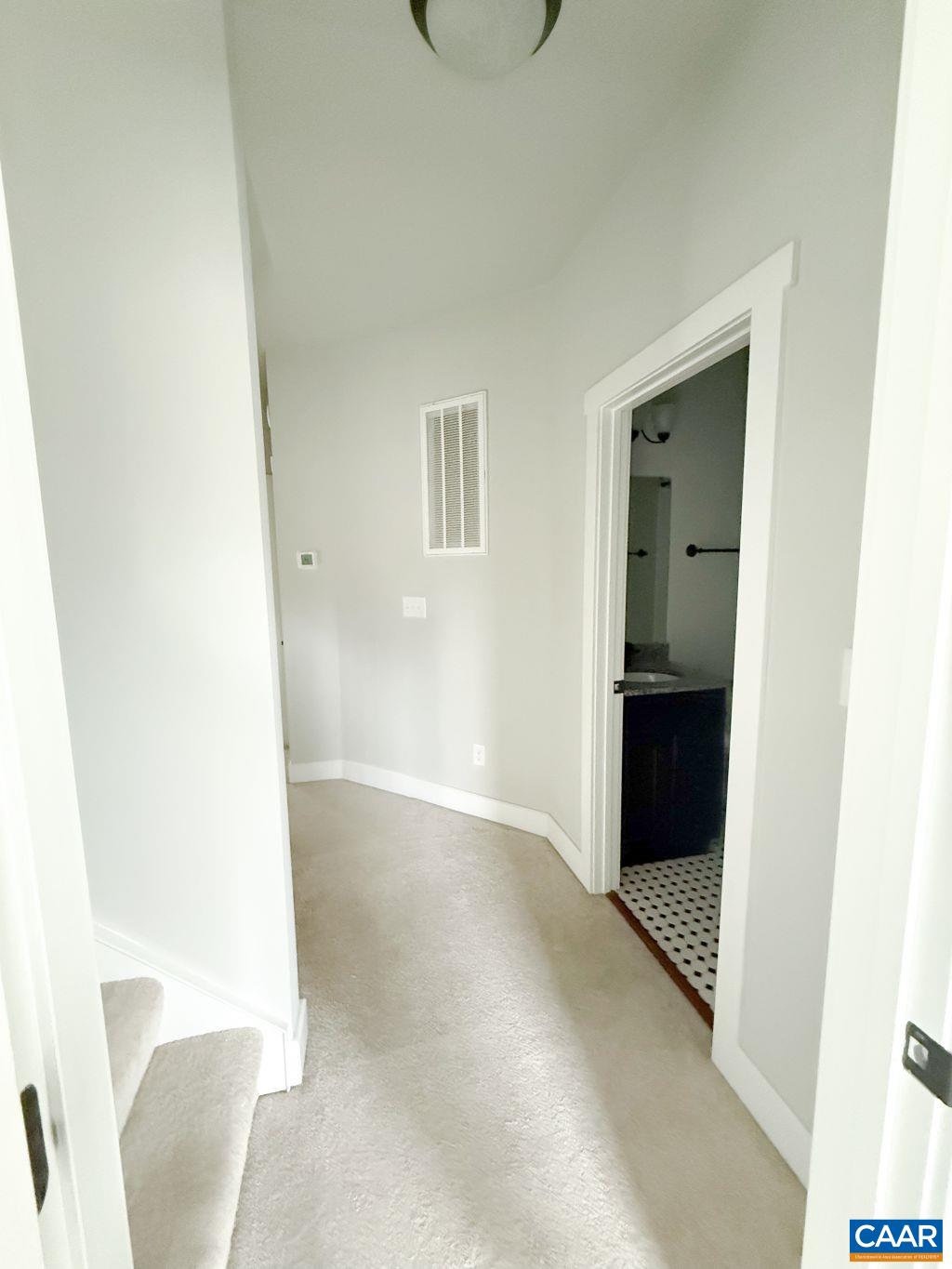 2038 Avinity Loop Charlottesville, VA 22902 - Photo 15 of 36 a view of an empty room with wooden floor
