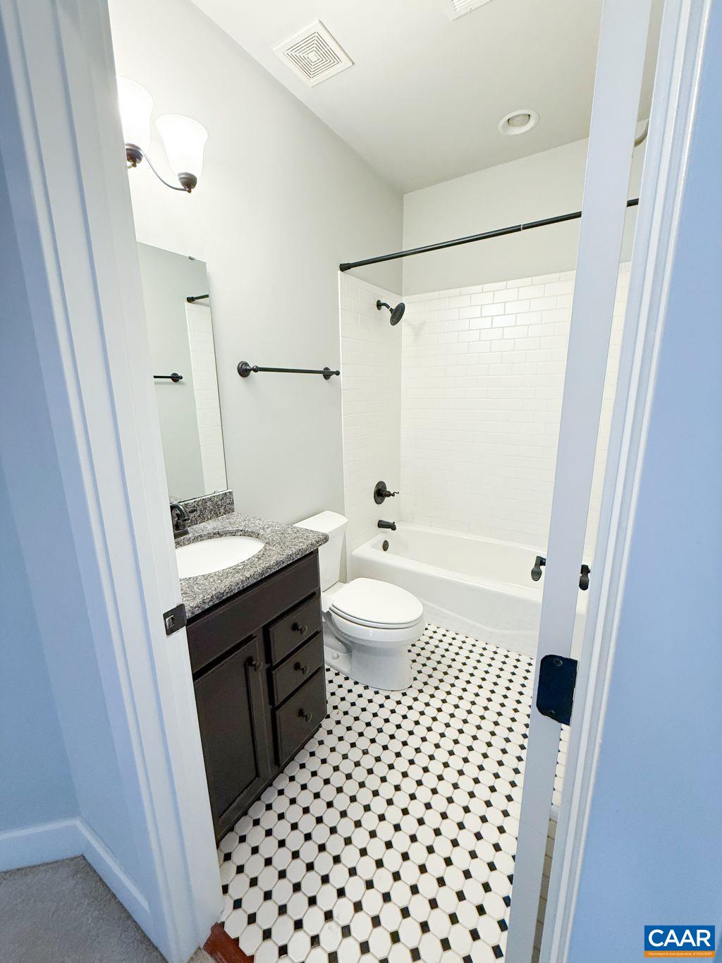 2038 Avinity Loop Charlottesville, VA 22902 - Photo 16 of 36 a bathroom with a sink a toilet a mirror and shower