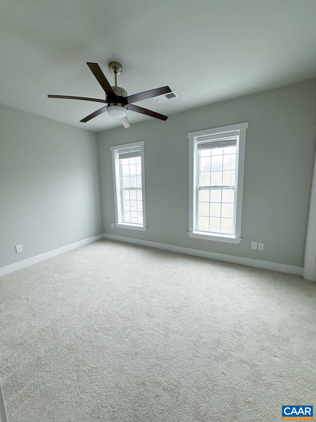 2038 Avinity Loop Charlottesville, VA 22902 - Photo 17 of 36 an empty room with windows and ceiling fan