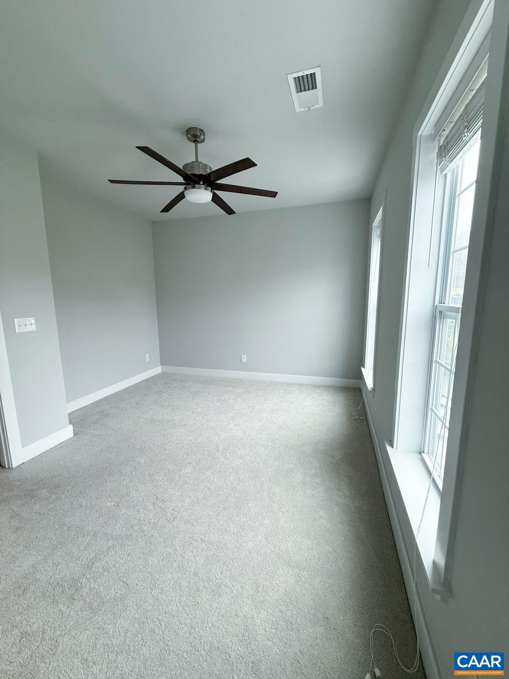 2038 Avinity Loop Charlottesville, VA 22902 - Photo 18 of 36 an empty room with windows and fan