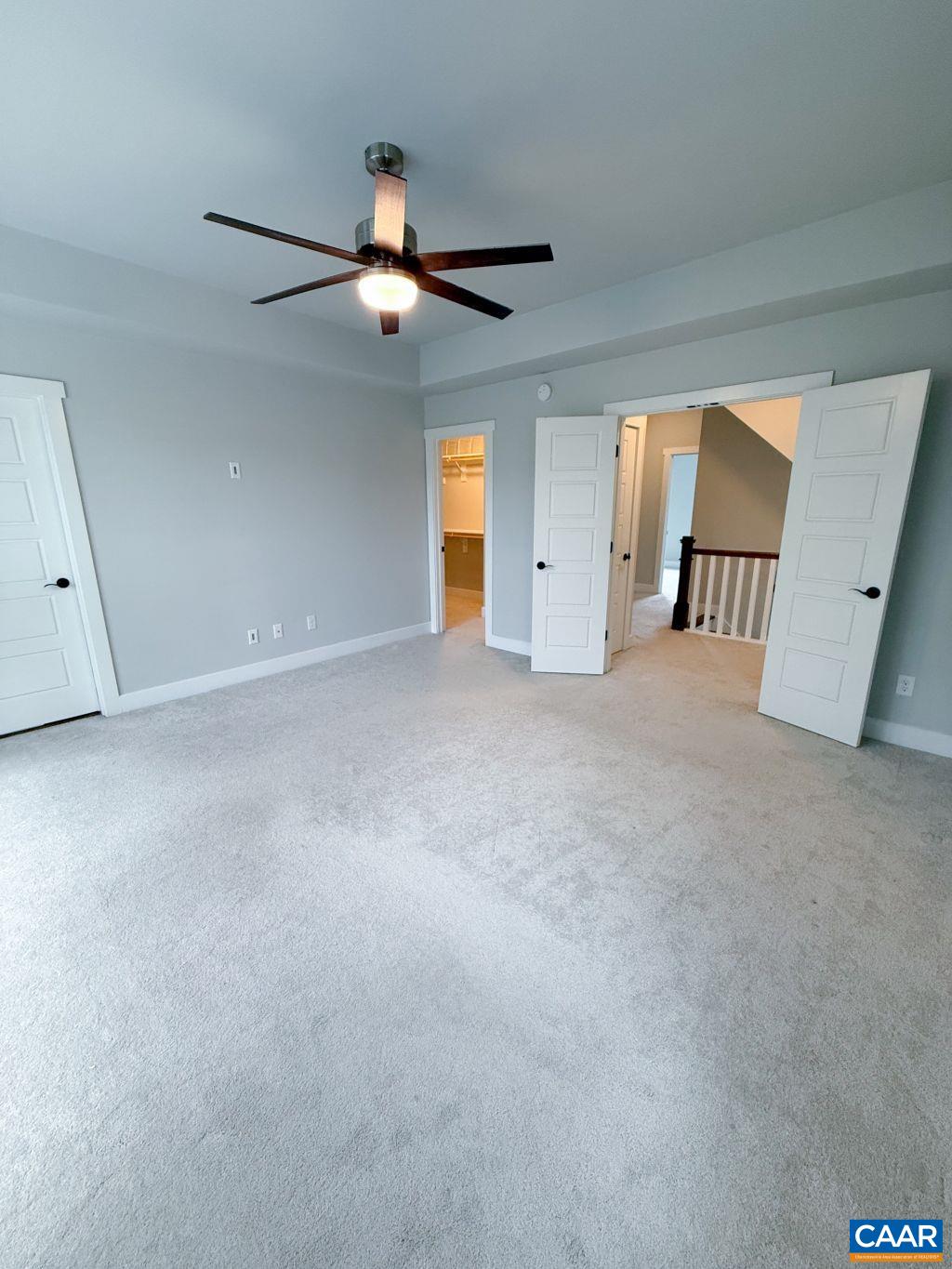 2038 Avinity Loop Charlottesville, VA 22902 - Photo 23 of 36 an empty room with windows and ceiling fan