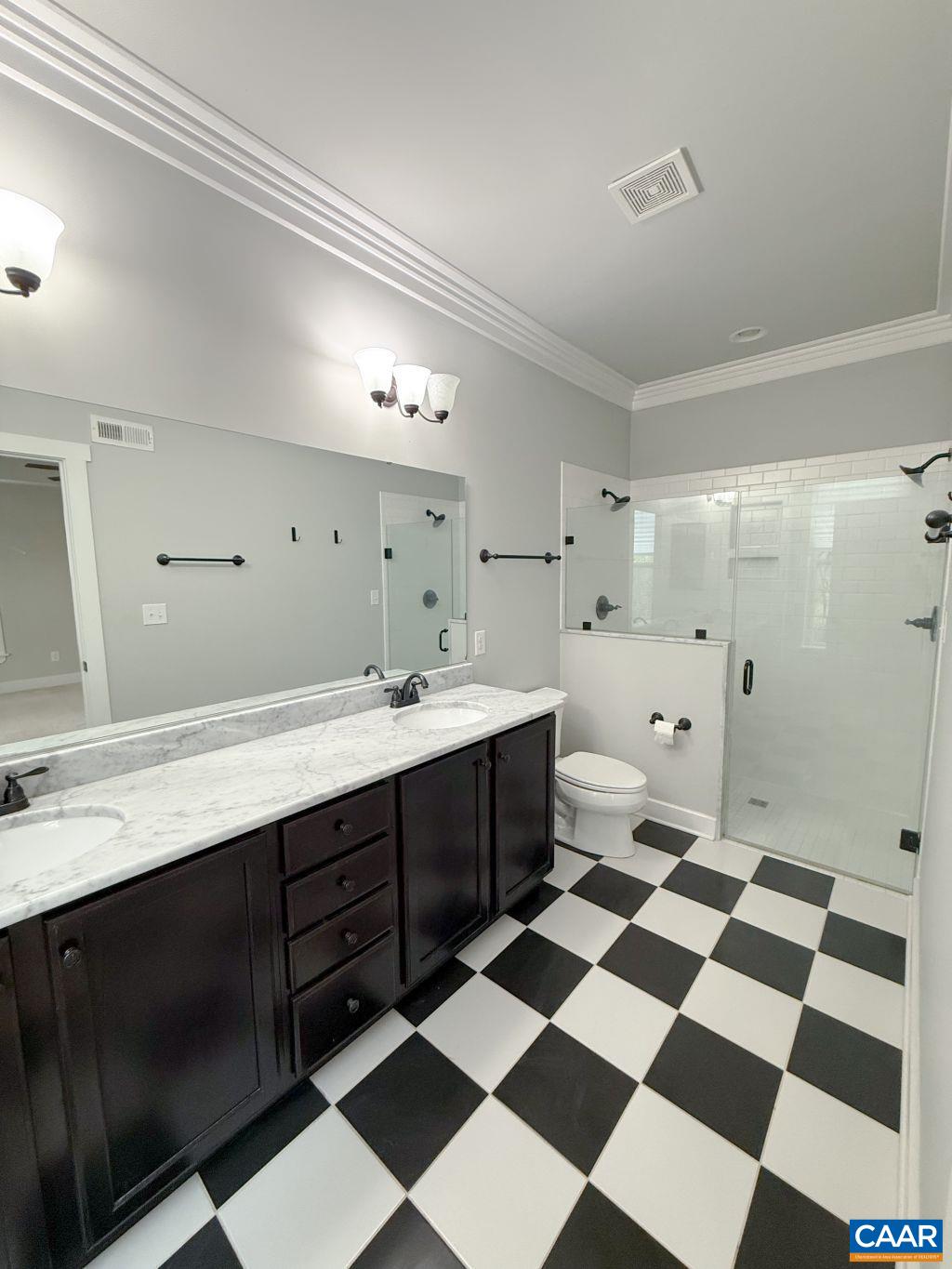 2038 Avinity Loop Charlottesville, VA 22902 - Photo 25 of 36 a spacious bathroom with a sink a mirror and a shower