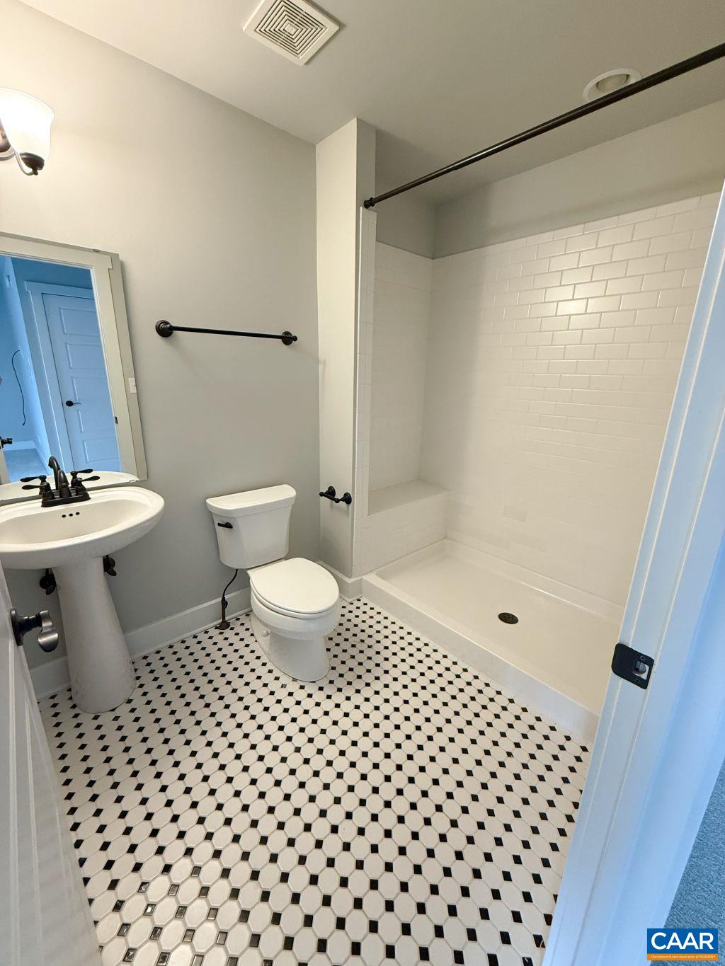 2038 Avinity Loop Charlottesville, VA 22902 - Photo 31 of 36 a bathroom with a toilet a sink and shower