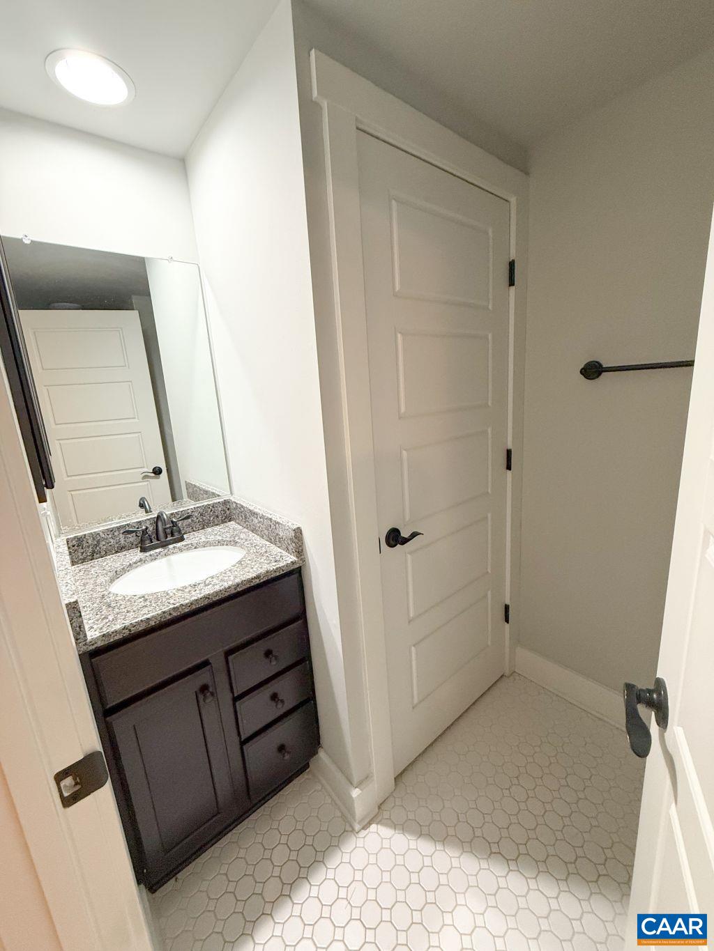 2038 Avinity Loop Charlottesville, VA 22902 - Photo 7 of 36 a bathroom with a granite countertop sink toilet and shower