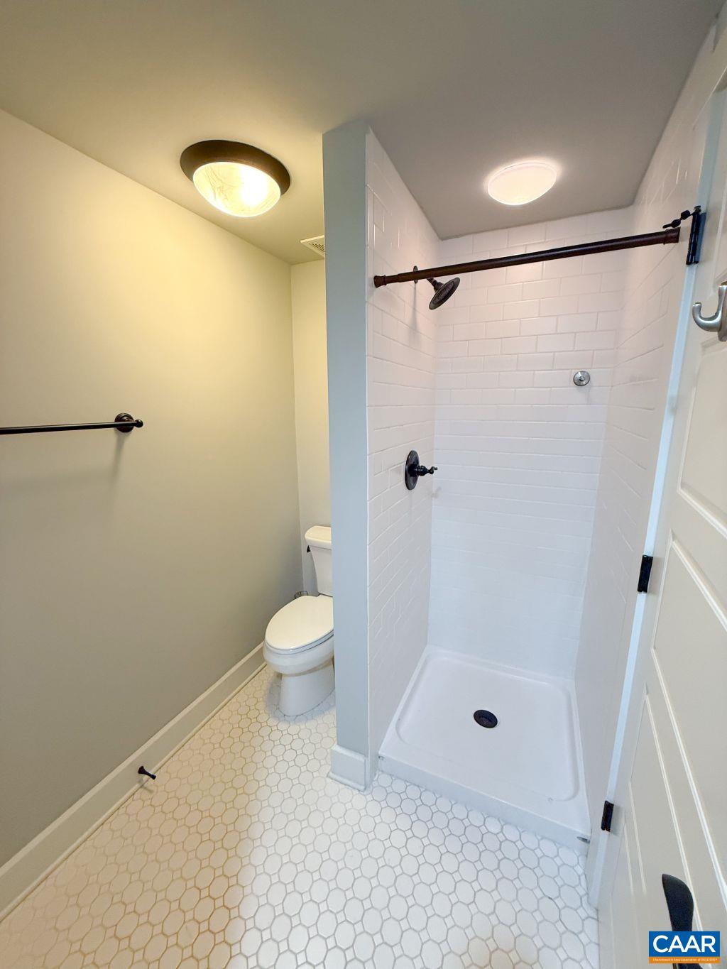 2038 Avinity Loop Charlottesville, VA 22902 - Photo 8 of 36 a bathroom with a shower and a toilet