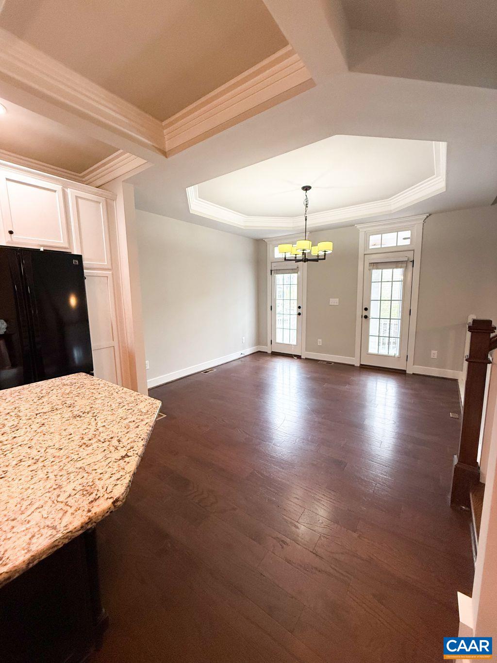 2038 Avinity Loop Charlottesville, VA 22902 - Photo 10 of 36 a view of an empty room with window and wooden floor