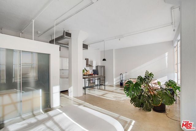 a bathroom with a toilet a sink and bathtub