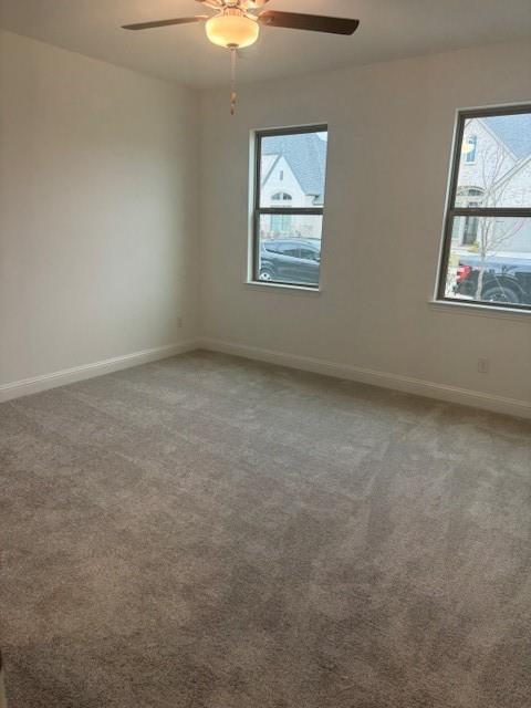 3108 Windecup Road Celina, TX 75009 - Photo 11 of 31 an empty room with windows and fan