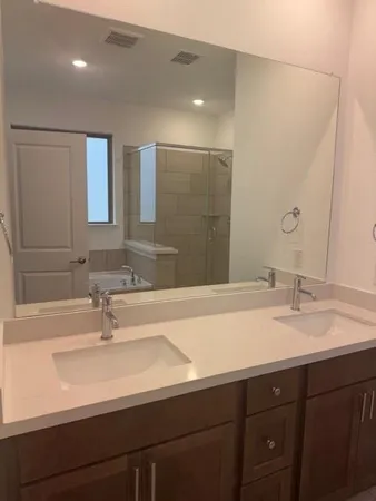 a bathroom with a sink and a mirror