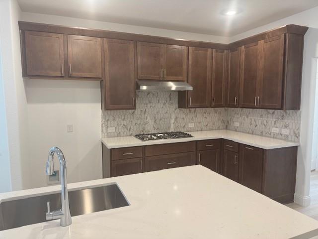 3108 Windecup Road Celina, TX 75009 - Photo 6 of 31 a kitchen with kitchen island a sink appliances and cabinets