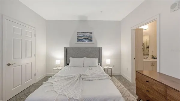 a bedroom with a bed and a closet