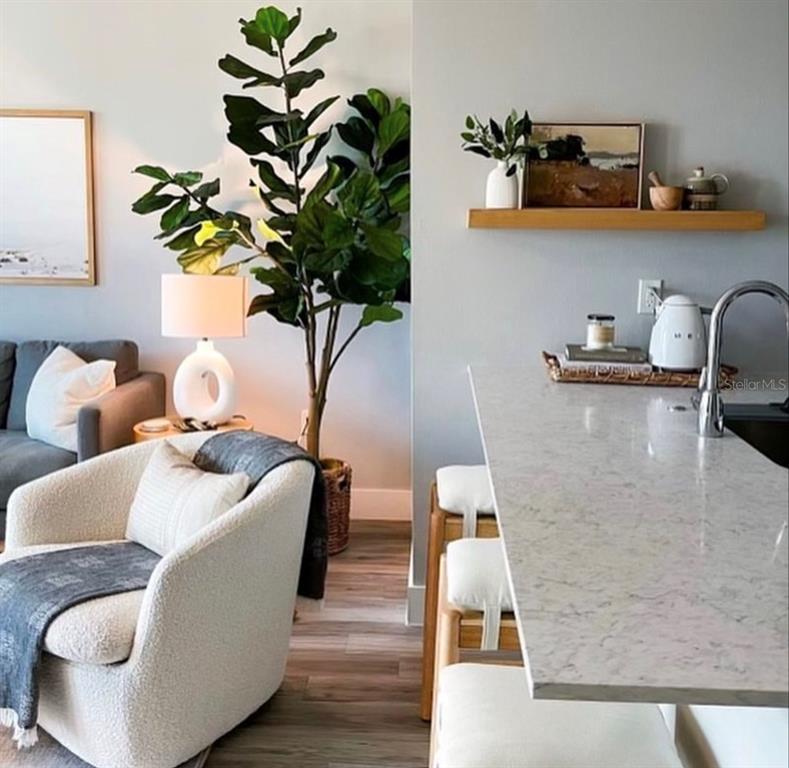 1659 2nd Street, Unit 515 Sarasota, FL 34236 - Photo 6 of 21 a living room with furniture and a potted plant