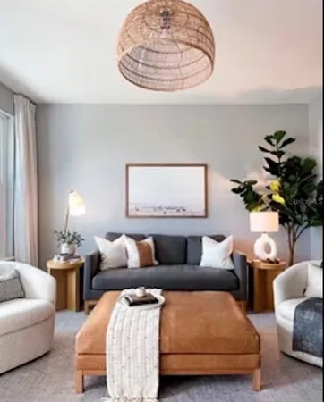 a living room with furniture and a lamp