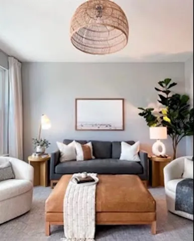 a living room with furniture and a lamp