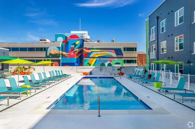 a play room with toys and a book shelf