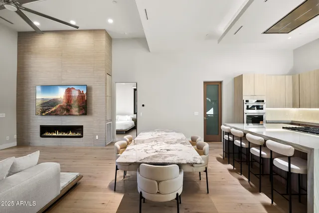 a bedroom with a large bed and a large window