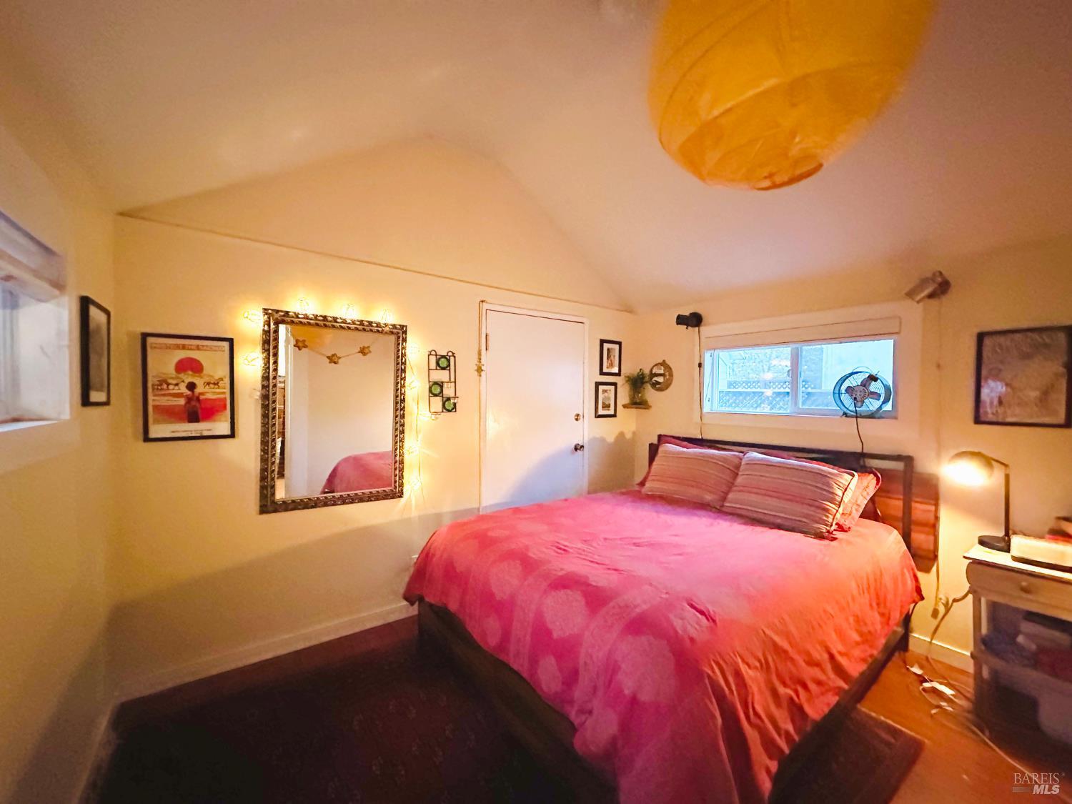 108 Pierson Street Santa Rosa, CA 95401 - Photo 12 of 33 a bedroom with a bed and lamp with the walls