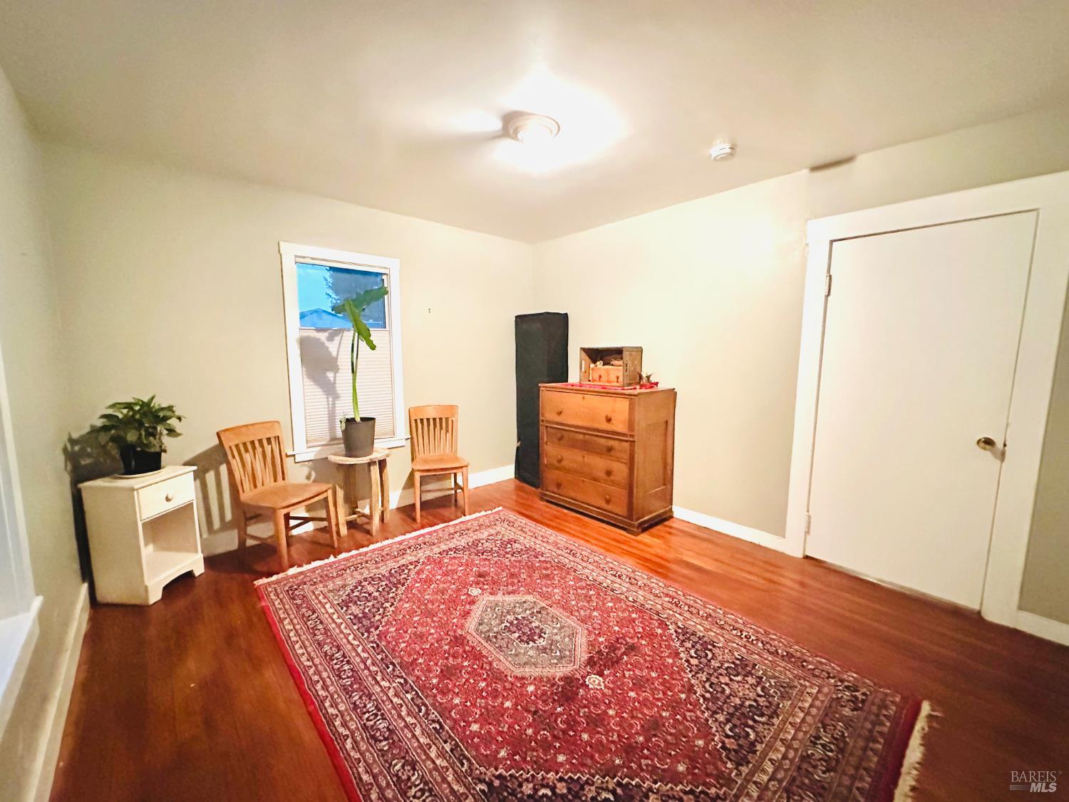108 Pierson Street Santa Rosa, CA 95401 - Photo 16 of 33 a spacious bedroom with a bed and wooden floor