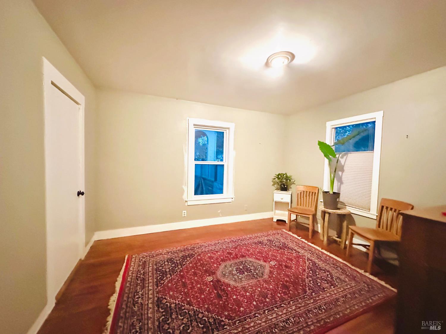 108 Pierson Street Santa Rosa, CA 95401 - Photo 17 of 33 a bedroom with a bed and wooden floor
